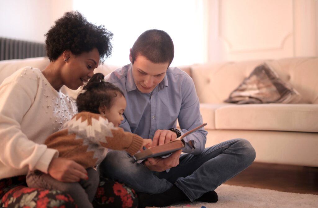 Family storytelling, a happy family story time. father, mother, daughter